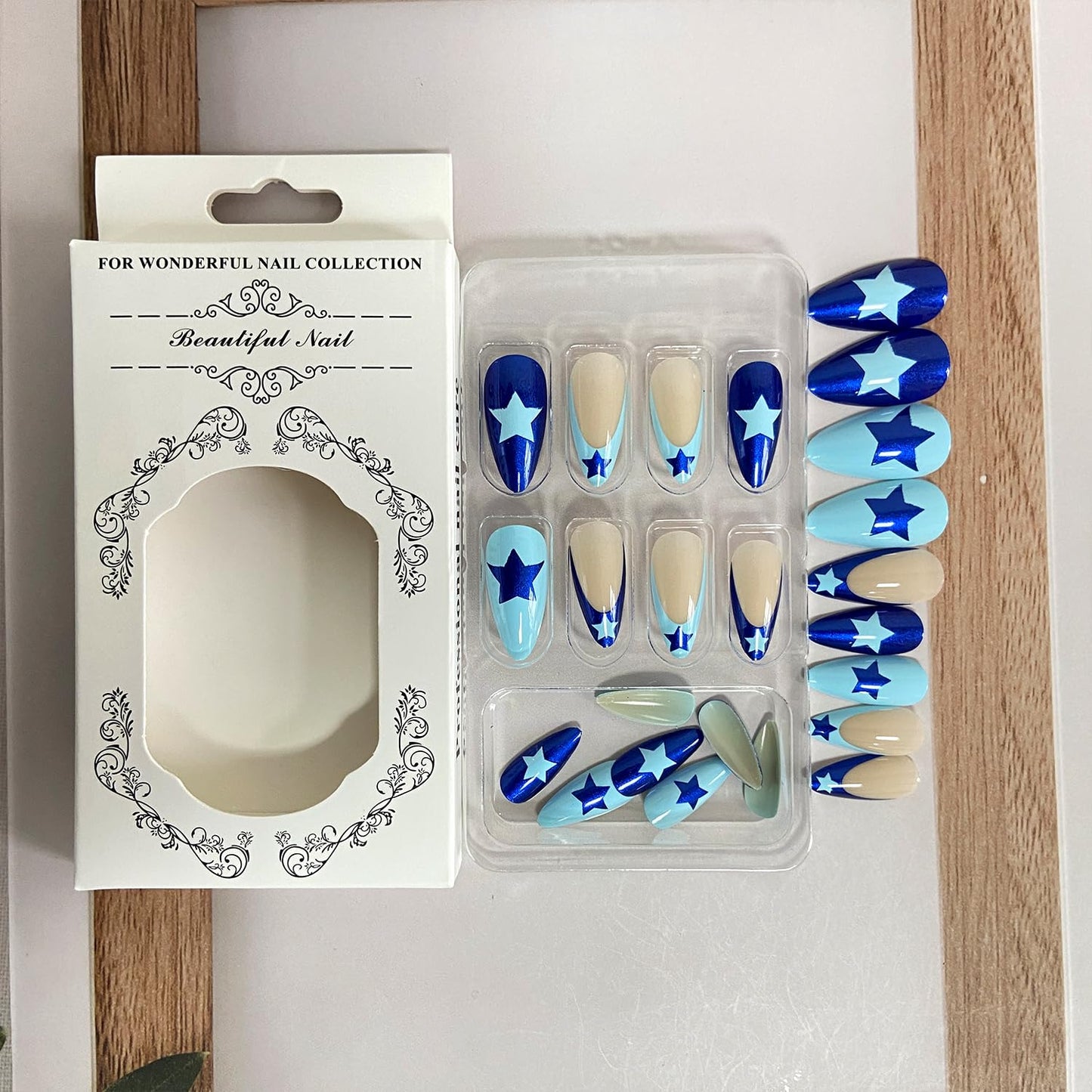 Stunning Blue French Tip Press-On Nails - Medium Almond Shape with Star Designs - 24 Reusable Acrylic Stick-On Nails for Effortless Glam!