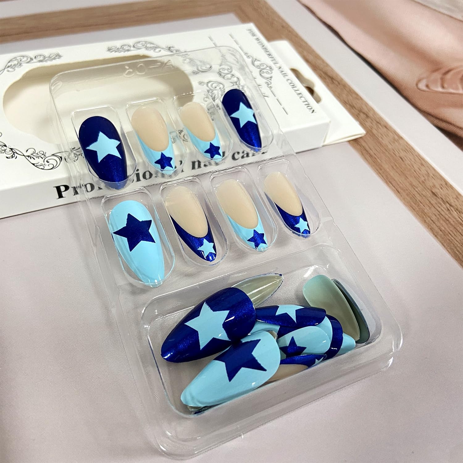 Stunning Blue French Tip Press-On Nails - Medium Almond Shape with Star Designs - 24 Reusable Acrylic Stick-On Nails for Effortless Glam!