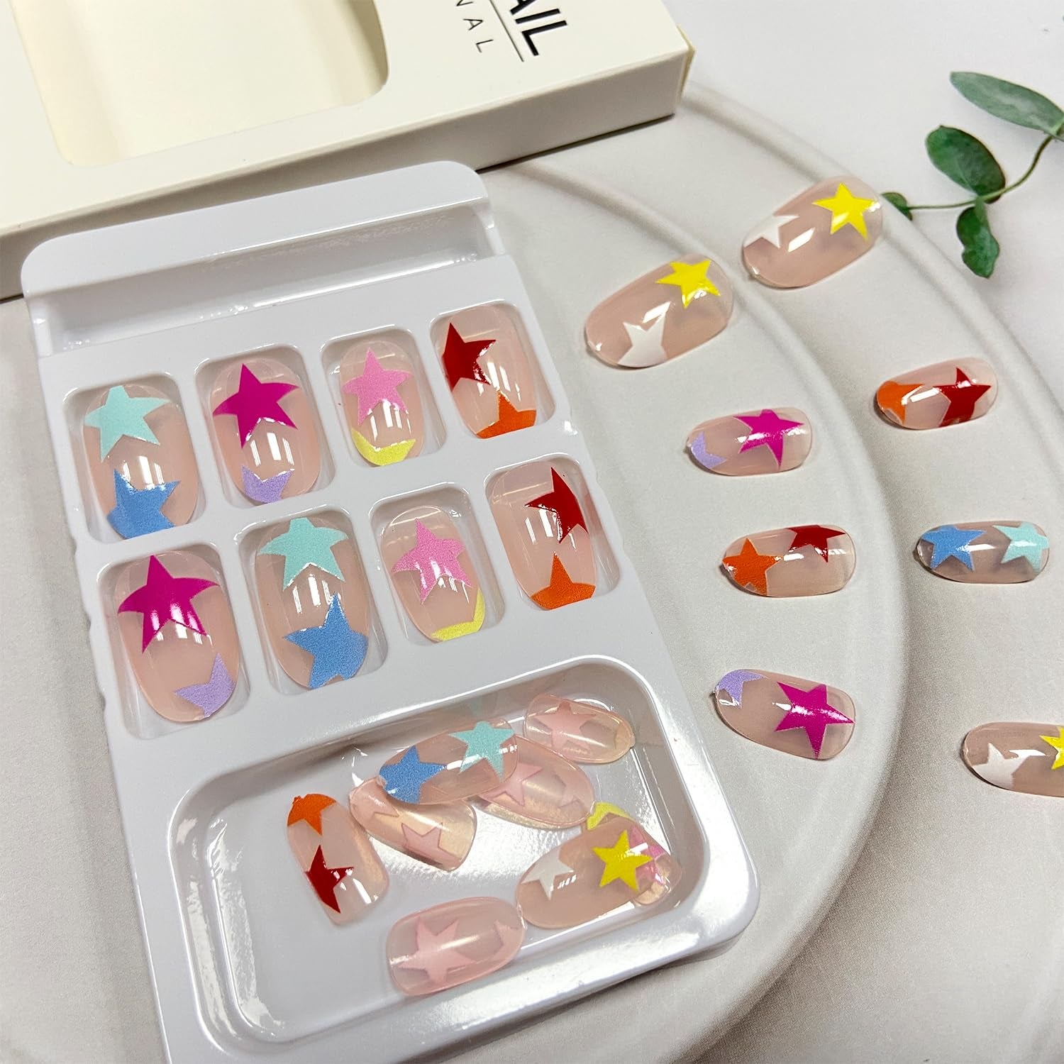 Vibrant Starry Press-On Nails - Short Oval Full Cover Acrylics with Reusable Five-Pointed Star Designs - 24 Pcs for Women & Girls