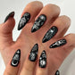 Glamorous Long Stiletto Press-On Nails with Black Edge, Gold Thread, and Rhinestones - Perfect for a Stunning Manicure!